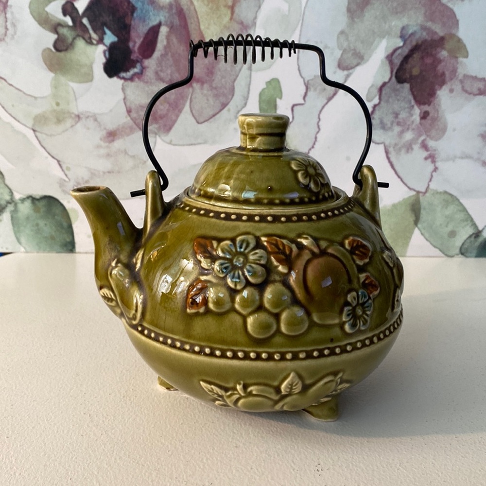 Vintage olive green teapot with fruit and floral design. Signed Japan.